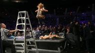 Mike held the ladder to ensure Lynch delivered the leg drop safely